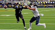 Nov 16, 2025; Inglewood, California, USA; Los Angeles Rams cornerback Emmanuel Forbes Jr. (1) breaks up a pass intended for Seattle Seahawks wide receiver Jaxon Smith-Njigba (11) during the first half at SoFi Stadium.