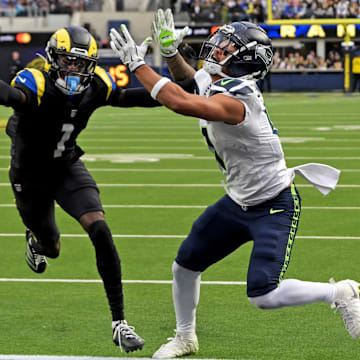 Nov 16, 2025; Inglewood, California, USA; Los Angeles Rams cornerback Emmanuel Forbes Jr. (1) breaks up a pass intended for Seattle Seahawks wide receiver Jaxon Smith-Njigba (11) during the first half at SoFi Stadium.