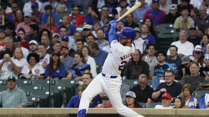 Aug 6, 2024; Chicago, Illinois, USA; Chicago Cubs designated hitter Cody Bellinger (24) hits an infield single against the Minnesota Twins during the first inning at Wrigley Field.