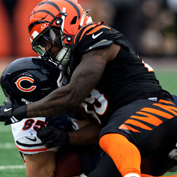 Cincinnati Bengals linebacker Barrett Carter puts a hit on Bears tight end Cole Kmet in the second quarter Sunday.