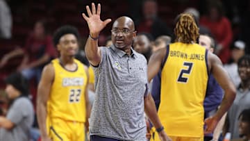 UNC Greensboro coach Mike Jones against Arkansas at Bud Walton Arena. 