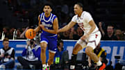 Mar 22, 2025; Wichita, KS, USA; Drake Bulldogs guard Kael Combs (11) dribbles the ball against Texas Tech Red Raiders forward Darrion Williams (5) during the first half at Intrust Bank Arena. Mandatory Credit: Nick Tre. Smith-Imagn Images