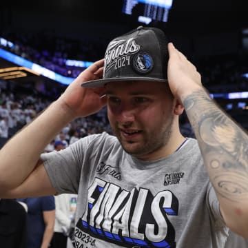 May 30, 2024; Minneapolis, Minnesota, USA; Dallas Mavericks guard Luka Doncic (77) celebrates after winning the Western Conference Championship against the Minnesota Timberwolves in game five of the western conference finals for the 2024 NBA playoffs at Target Center. Mandatory Credit: Jesse Johnson-USA TODAY Sports