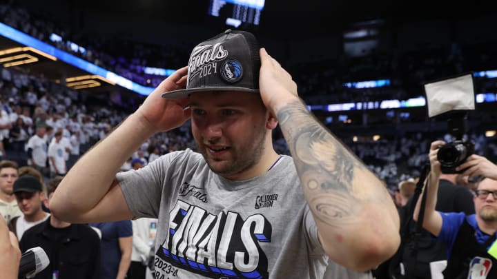 May 30, 2024; Minneapolis, Minnesota, USA; Dallas Mavericks guard Luka Doncic (77) celebrates after winning the Western Conference Championship against the Minnesota Timberwolves in game five of the western conference finals for the 2024 NBA playoffs at Target Center. Mandatory Credit: Jesse Johnson-USA TODAY Sports