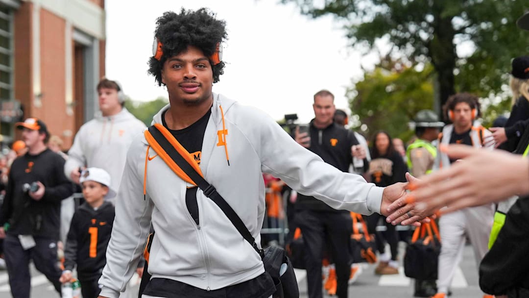 Tennessee running back DeSean Bishop (18) high-fives fans at the Vol Walk before a NCAA football game between the Tennessee Volunteers and Oklahoma Sooners at Neyland Stadium in Knoxville, Tenn., on November 1, 2025.