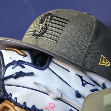 May 20, 2023; Atlanta, Georgia, USA; A detailed view of the Seattle Mariners armed forces day hat in the dugout against the Atlanta Braves in the first inning at Truist Park. Mandatory Credit: Brett Davis-Imagn Images