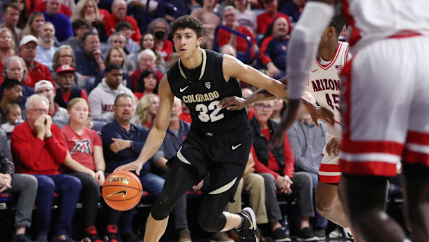 Feb 18, 2023; Tucson, Arizona, USA; Colorado Buffaloes guard Nique Clifford (32) drives to the net against Arizona Wildcats g