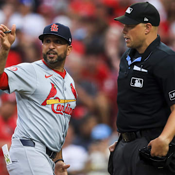 Aug 12, 2024; Cincinnati, Ohio, USA; St. Louis Cardinals manager Oliver Marmol (37) argues with home plate umpire Stu Scheurwater (85) in the fifth inning against the Cincinnati Reds at Great American Ball Park. Mandatory Credit: Katie Stratman-Imagn Images