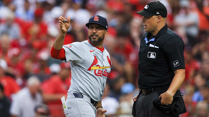 Aug 12, 2024; Cincinnati, Ohio, USA; St. Louis Cardinals manager Oliver Marmol (37) argues with home plate umpire Stu Scheurwater (85) in the fifth inning against the Cincinnati Reds at Great American Ball Park. Mandatory Credit: Katie Stratman-Imagn Images