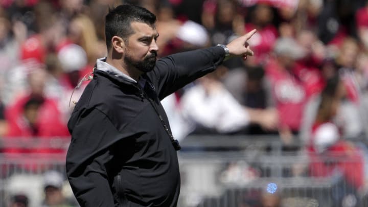 April 13, 2024; Columbus, Ohio, USA; 
Ohio State head football coach Ryan Day speaks to players during the first half of the LifeSports spring football game at Ohio Stadium on Saturday.