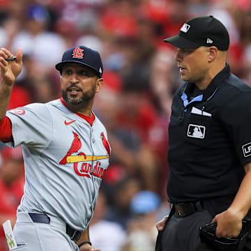 Aug 12, 2024; Cincinnati, Ohio, USA; St. Louis Cardinals manager Oliver Marmol (37) argues with home plate umpire Stu Scheurwater (85) in the fifth inning against the Cincinnati Reds at Great American Ball Park. Mandatory Credit: Katie Stratman-Imagn Images