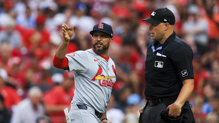 Aug 12, 2024; Cincinnati, Ohio, USA; St. Louis Cardinals manager Oliver Marmol (37) argues with home plate umpire Stu Scheurwater (85) in the fifth inning against the Cincinnati Reds at Great American Ball Park. Mandatory Credit: Katie Stratman-Imagn Images