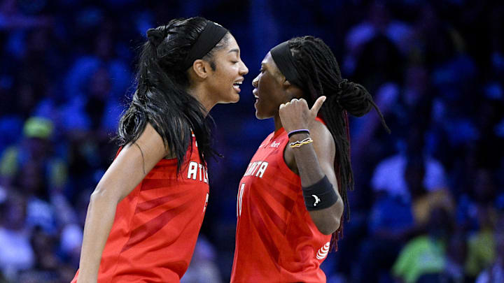 May 12, 2026; Arlington, Texas, USA; Atlanta Dream forward Angel Reese (5) and guard Rhyne Howard (10) celebrate during the second half against the Dallas Wings at College Park Center. Mandatory Credit: Jerome Miron-Imagn Images