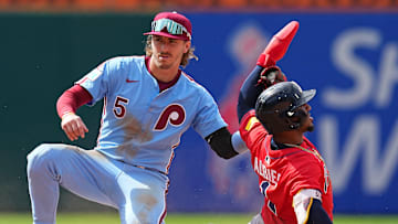Philadelphia Phillies second baseman Bryson Stott tags Atlanta Braves' Ozzie Albies.