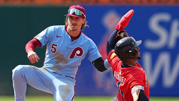 Philadelphia Phillies second baseman Bryson Stott tags Atlanta Braves' Ozzie Albies.