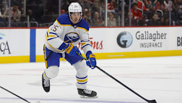Nov 2, 2024; Detroit, Michigan, USA; Buffalo Sabres defenseman Owen Power (25) handles the puck during the first period of the game against the Detroit Red Wings at Little Caesars Arena. Mandatory Credit: Brian Bradshaw Sevald-Imagn Images