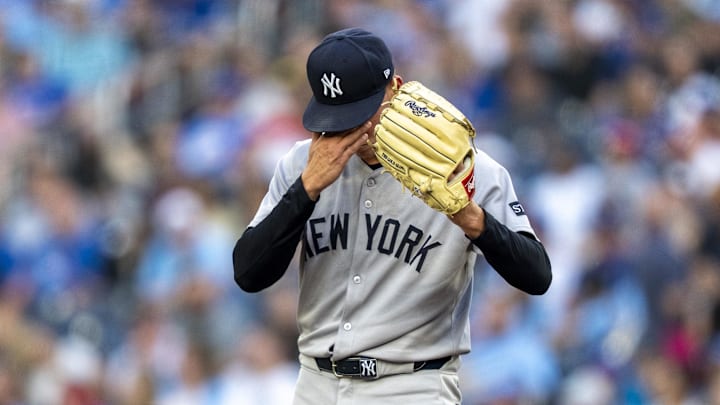 Jul 2, 2025; Toronto, Ontario, CAN; New York Yankees pitcher Will Warren (98) wipes his forehead during the first inning in their MLB game against the Toronto Blue Jays at Rogers Centre. Mandatory Credit: Kevin Sousa-Imagn Images Jul 2, 2025; Toronto, Ontario, CAN; New York Yankees pitcher Will Warren (98) wipes his forehead during the first inning in their MLB game against the Toronto Blue Jays at Rogers Centre. Mandatory Credit: Kevin Sousa-Imagn Images