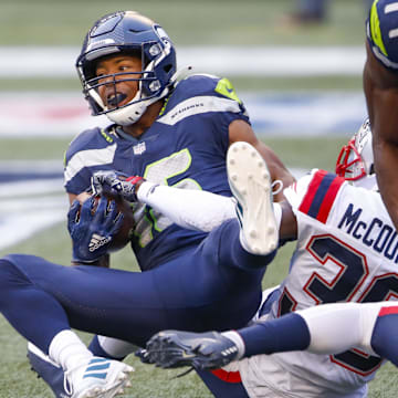 Sep 20, 2020; Seattle, Washington, USA; Seattle Seahawks wide receiver Tyler Lockett (16) catches a touchdown pass against the New England Patriots during the first quarter at CenturyLink Field.