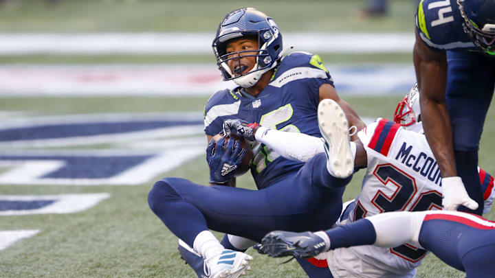 Sep 20, 2020; Seattle, Washington, USA; Seattle Seahawks wide receiver Tyler Lockett (16) catches a touchdown pass against the New England Patriots during the first quarter at CenturyLink Field.