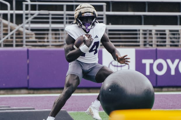 Adam Mohammed shows off his muscles in spring ball. 