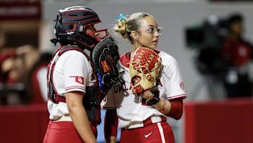 Oklahoma catcher Isabela Emerling, left, and pitcher Sam Landry, right, talk during an NCAA softball game between the Oklahoma Sooners (OU) and the Tennessee Lady Volunteers at Love's Field in Norman, Okla., Friday, March 28, 2025.
