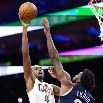 Nov 21, 2023; Philadelphia, Pennsylvania, USA; Cleveland Cavaliers forward Evan Mobley (4) shoots over Philadelphia 76ers center Joel Embiid (21) during the second quarter at Wells Fargo Center. Mandatory Credit: Bill Streicher-Imagn Images
