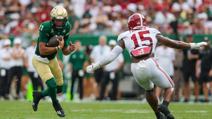 Sep 16, 2023; Tampa, Florida, USA;  South Florida Bulls quarterback Byrum Brown (17)  is pressured by Alabama Crimson Tide linebacker Dallas Turner (15) in the first quarter at Raymond James Stadium. Mandatory Credit: Nathan Ray Seebeck-USA TODAY Sports