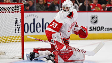Oct 1, 2022; Chicago, Illinois, USA;  Detroit Red Wings goaltender Sebastian Cossa (33) defends the net against the Chicago Blackhawks at United Center. Mandatory Credit: Jamie Sabau-Imagn Images