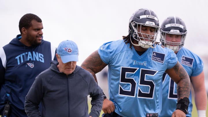 Tennessee Titans Offensive Line Coach Bill Callahan, left, and first-round draft pick JC Latham (55) head to the next drill during rookie minicamp at Ascension Saint Thomas Sports Park in Nashville, Tenn., Friday, May 10, 2024.