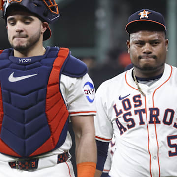Houston Astros starting pitcher Framber Valdez (59) walks on the field with catcher Yainer Diaz (21) before the game against the Seattle Mariners at Daikin Park. 