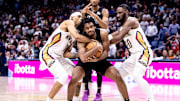 Nov 11, 2024; New Orleans, Louisiana, USA;  New Orleans Pelicans guard Brandon Boston Jr. (11) fouls Brooklyn Nets guard Cam Thomas (24) during the second half at Smoothie King Center. Mandatory Credit: Stephen Lew-Imagn Images