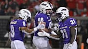 Nov 5, 2022; Louisville, Kentucky, USA;  James Madison Dukes running back Percy Agyei-Obese (31) celebrates a touchdown with wide receiver Kris Thornton (8) and offensive lineman Cole Potts (66) during the first half against the Louisville Cardinals at Cardinal Stadium. Mandatory Credit: Jamie Rhodes-Imagn Images