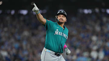 Oct 19, 2025; Toronto, Ontario, CAN; Seattle Mariners first baseman Josh Naylor (12) reacts after hitting a home run in the sixth inning against the Toronto Blue Jays during game six of the ALCS round for the 2025 MLB playoffs at Rogers Centre. Mandatory Credit: Nick Turchiaro-Imagn Images