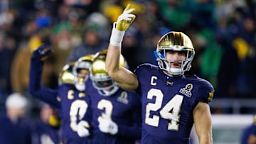 Notre Dame linebacker Jack Kiser (24) hypes up the crowd during the first round of the College Football Playoff between Notre Dame and Indiana at Notre Dame Stadium on Friday, Dec. 20, 2024, in South Bend.
