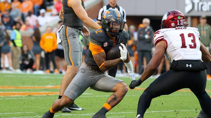 Nov 15, 2025; Knoxville, Tennessee, USA;  Tennessee Volunteers running back Peyton Lewis (2) runs the ball against the New Mexico State Aggies during the first quarter at Neyland Stadium. Mandatory Credit: Randy Sartin-Imagn Images