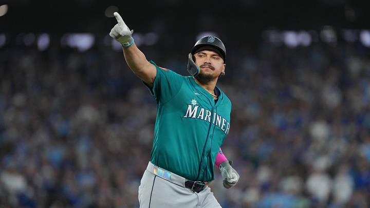 Oct 19, 2025; Toronto, Ontario, CAN; Seattle Mariners first baseman Josh Naylor (12) reacts after hitting a home run in the sixth inning against the Toronto Blue Jays during game six of the ALCS round for the 2025 MLB playoffs at Rogers Centre. Mandatory Credit: Nick Turchiaro-Imagn Images
