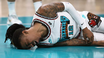 Apr 24, 2025; Memphis, Tennessee, USA; Memphis Grizzlies guard Ja Morant (12) lays on the court after being fouled during the second quarter against the Oklahoma City Thunder during game three for the first round of the 2024 NBA Playoffs at FedExForum. Mandatory Credit: Petre Thomas-Imagn Images