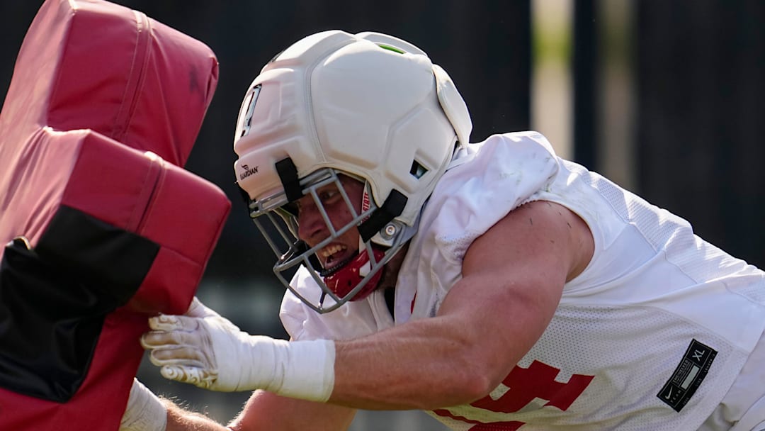 Ohio State Buckeyes defensive end Beau Atkinson (14) hits a tackle sled during football training camp at the Woody Hayes Athletic Center on Aug. 1, 2025.
