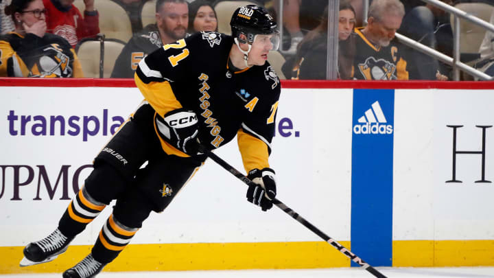 Apr 11, 2024; Pittsburgh, Pennsylvania, USA;  Pittsburgh Penguins center Evgeni Malkin (71) moves the puck against the Detroit Red Wings in overtime at PPG Paints Arena. Mandatory Credit: Charles LeClaire-USA TODAY Sports