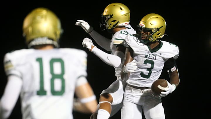 Iowa City West’s Julian Manson (3) celebrates after scoring a touchdown against Iowa City Liberty Friday, Aug. 30, 2024 in North Liberty, Iowa.
