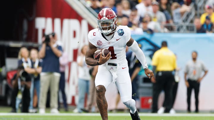 Dec 31, 2024; Tampa, FL, USA; Alabama Crimson Tide quarterback Jalen Milroe (4) runs with the ball against the Michigan Wolverines during the first half at Raymond James Stadium. Mandatory Credit: Matt Pendleton-Imagn Images Dec 31, 2024; Tampa, FL, USA; Alabama Crimson Tide quarterback Jalen Milroe (4) runs with the ball against the Michigan Wolverines during the first half at Raymond James Stadium. Mandatory Credit: Matt Pendleton-Imagn Images