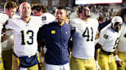 Nov 1, 2025; Chestnut Hill, Massachusetts, USA; Notre Dame Fighting Irish head coach Marcus Freeman, offensive lineman Joe Otting (64), safety Adon Shuler (8), defensive lineman Junior Tuihalamaka (44), quarterback CJ Carr (13) and defensive lineman Donovan Hinish (41) after the game against the Boston College Eagles at Alumni Stadium. 