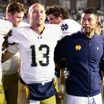 Nov 1, 2025; Chestnut Hill, Massachusetts, USA; Notre Dame Fighting Irish head coach Marcus Freeman, offensive lineman Joe Otting (64), safety Adon Shuler (8), defensive lineman Junior Tuihalamaka (44), quarterback CJ Carr (13) and defensive lineman Donovan Hinish (41) after the game against the Boston College Eagles at Alumni Stadium. 
