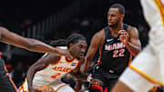 Oct 13, 2025; Atlanta, Georgia, USA; Atlanta Hawks guard Keaton Wallace (2) drives the ball towards the basket against Miami Heat forward Andrew Wiggins (22) during the first quarter at State Farm Arena. Mandatory Credit: Jordan Godfree-Imagn Images