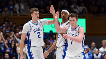 Jan 7, 2025; Durham, North Carolina, USA; Duke basketball forward Kon Knueppel (7) is greeted by teammates after hitting a three-pointer during the second half against the Pitt Panthers at Cameron Indoor Stadium. 