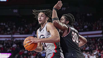 Jan 28, 2025; Athens, Georgia, USA; Georgia Bulldogs forward Asa Newell (14) tries to find room against South Carolina Gamecocks forward Collin Murray-Boyles (30)