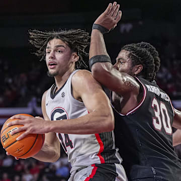 Jan 28, 2025; Athens, Georgia, USA; Georgia Bulldogs forward Asa Newell (14) tries to find room against South Carolina Gamecocks forward Collin Murray-Boyles (30) at Stegeman Coliseum. Mandatory Credit: Dale Zanine-Imagn Images