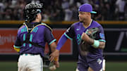 Sep 5, 2025; Phoenix, Arizona, USA; Arizona Diamondbacks catcher Gabriel Moreno (14) and second base Ketel Marte (4) celebrate after defeating the Boston Red Sox at Chase Field. Mandatory Credit: Rick Scuteri-Imagn Images