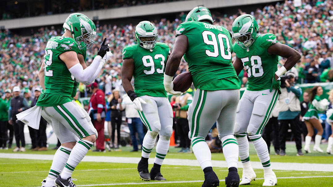 Dec 29, 2024; Philadelphia, Pennsylvania, USA; Philadelphia Eagles Jordan Davis (90) and  Milton Williams (93) and Jalyx Hunt (58) and Reed Blankenship (32) celebrate during the second quarter against the Dallas Cowboys at Lincoln Financial Field. Mandatory Credit: Bill Streicher-Imagn Images