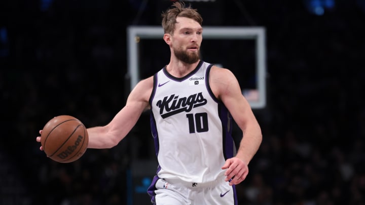 Apr 7, 2024; Brooklyn, New York, USA; Sacramento Kings forward Domantas Sabonis (10) dribbles up court during the first half against the Brooklyn Nets at Barclays Center. Mandatory Credit: Vincent Carchietta-USA TODAY Sports